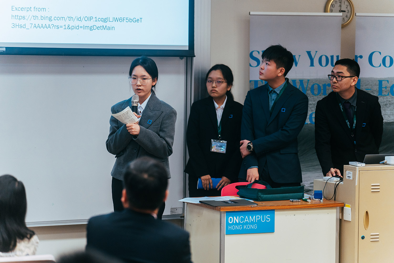 Live academic defense before judging panel
