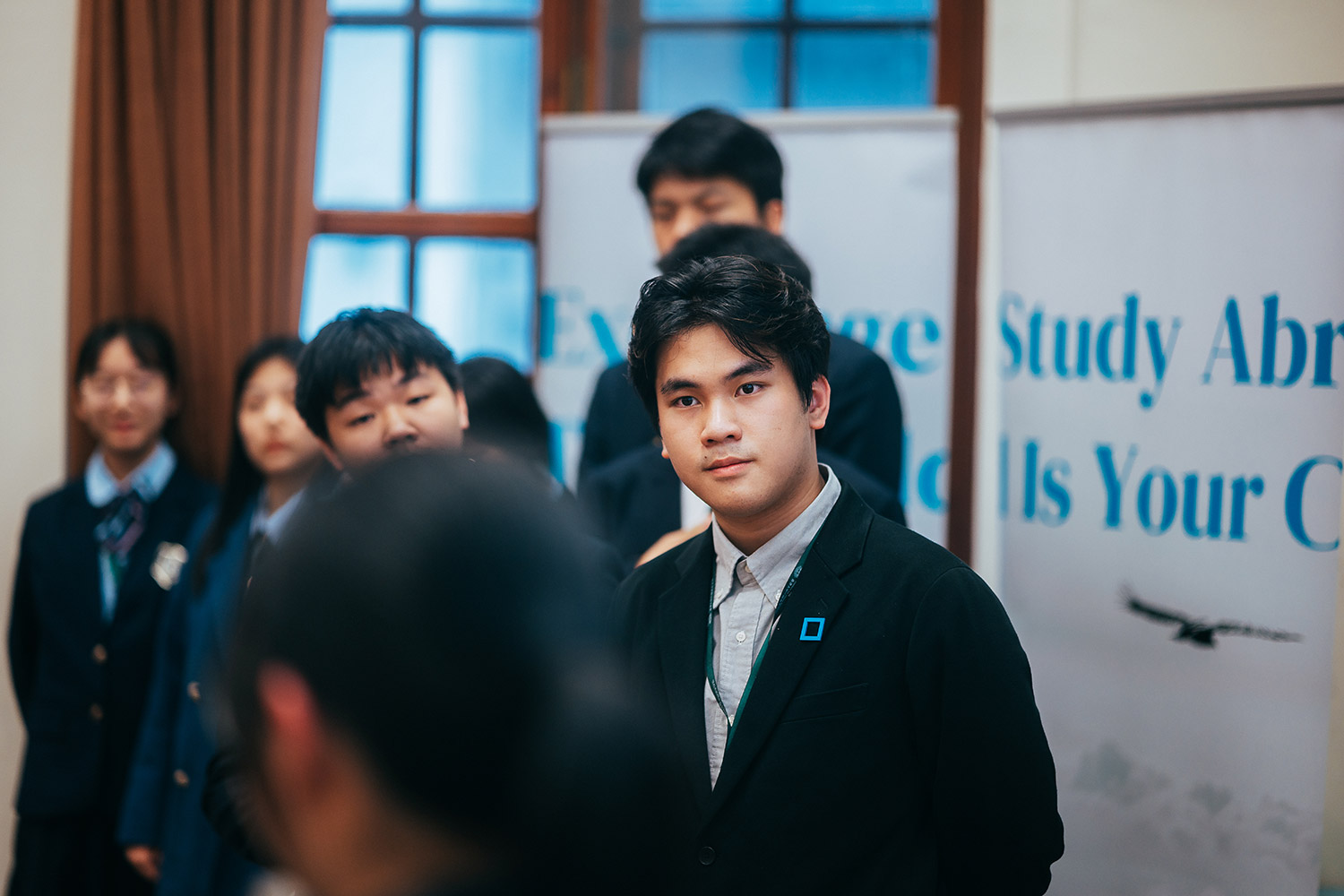 Two students discussing a model together